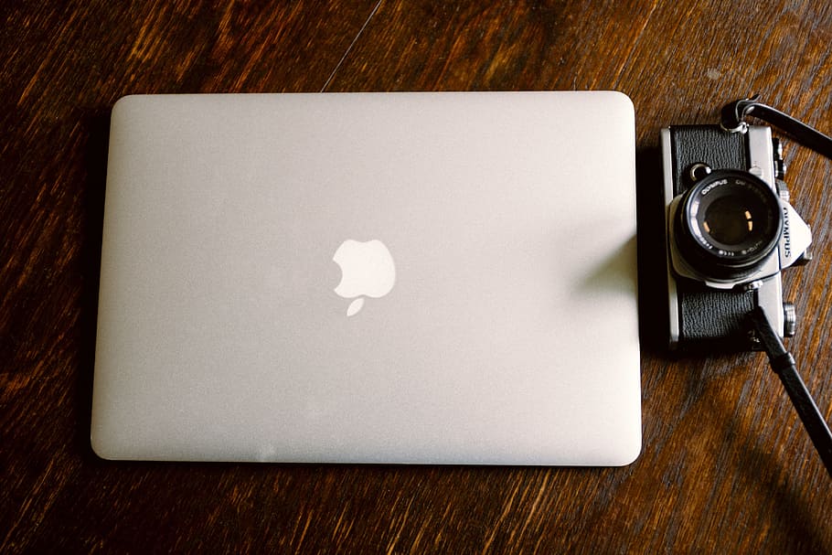 Closed macbook and a vintage camera, objects, technology, wood - Material HD wallpaper