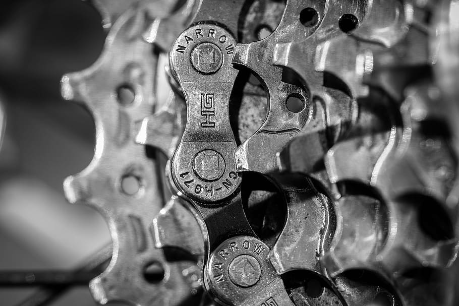 shallow focus of gray steel gears, bicycle, chain, the power transmission