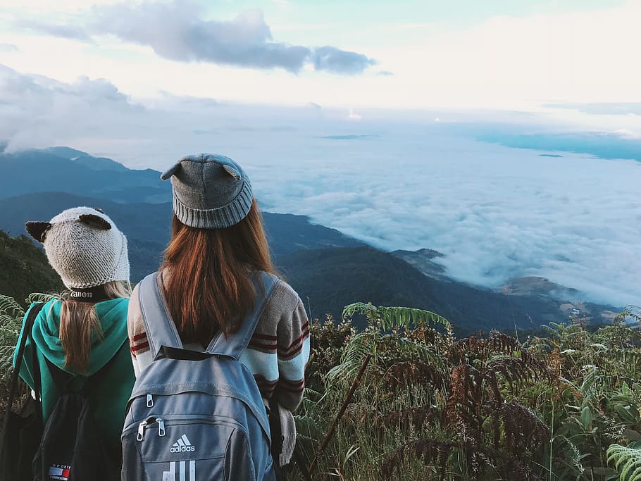 Two Woman Wearing White and Gray Crater Hat, backpack, bonnet HD wallpaper