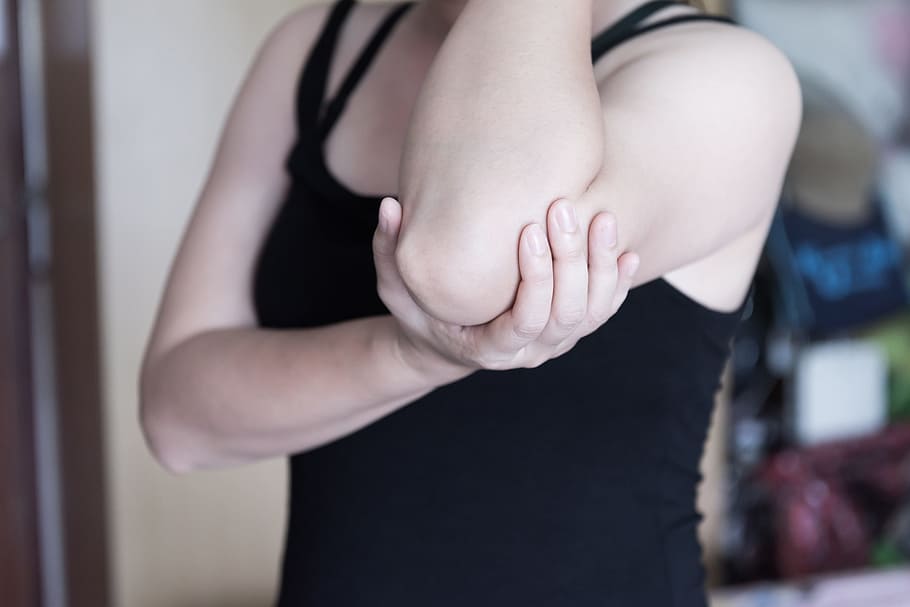 woman holding her left elbow, body, people, lifestyle, person