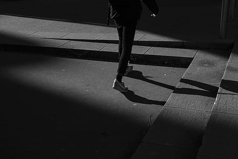 person wearing black pants and white shoes walking near gray concrete stairs, person waling near concrete stairs HD wallpaper