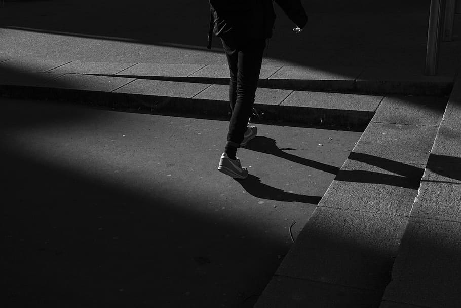 person wearing black pants and white shoes walking near gray concrete stairs, person waling near concrete stairs HD wallpaper
