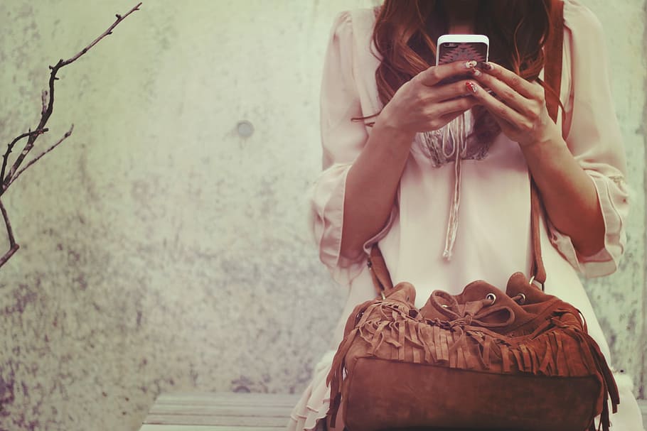 woman holding smartphone during daytime, women, females, people HD wallpaper