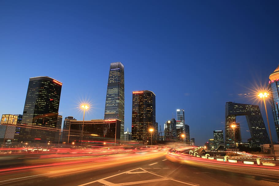 high-rise buildings during nighttime with road in vicinity, beijing