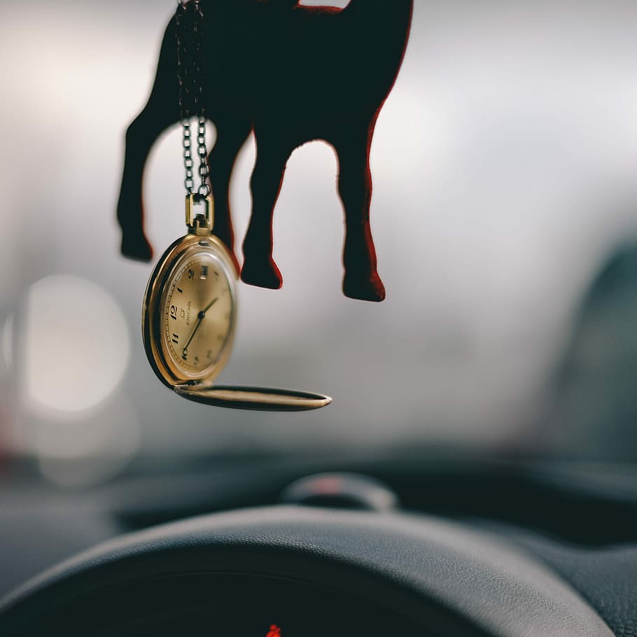 tilt shift lens photography of gold-colored pocket watch, round gold-colored pocket watch HD wallpaper
