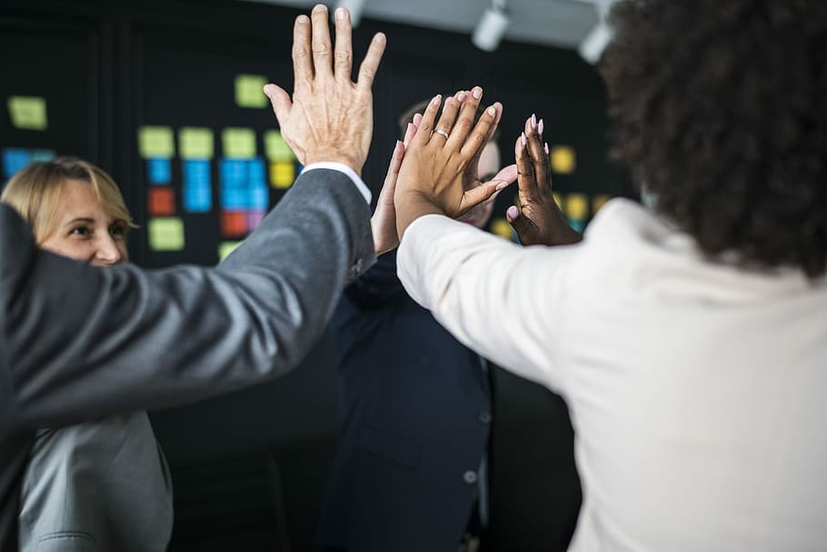 man in black suit jacket, team, hand, high five, teamwork, fun HD wallpaper