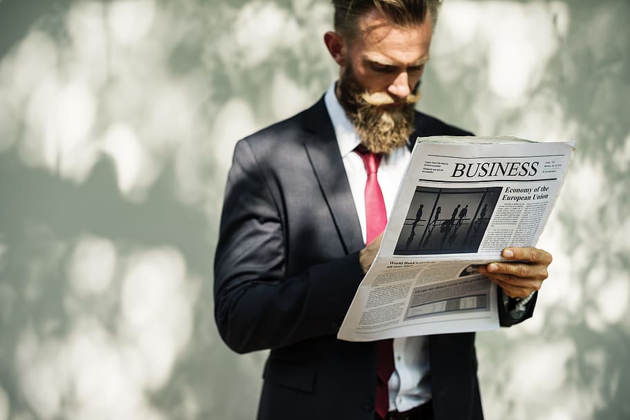 man holding Business newspaper print, reading, data, financial