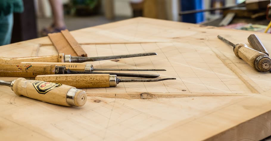 hand tools on top of table, chisel set on table, wood carving