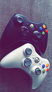 two black and white Xbox 360 controllers on gray textile, game HD wallpaper