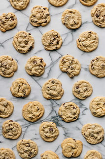 baked cookies on white concrete surface, brown cookies, biscuit HD wallpaper