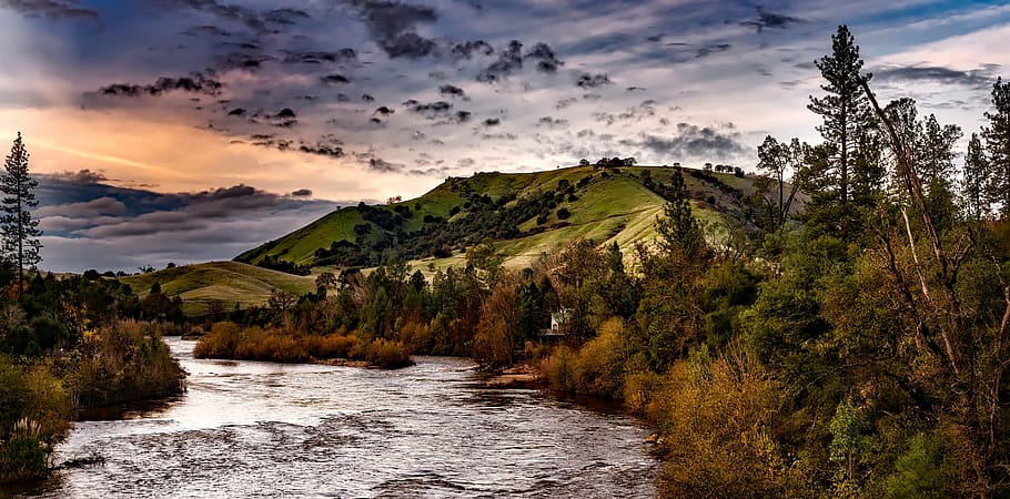 green forest near mountain under cloudy sky, american river HD wallpaper
