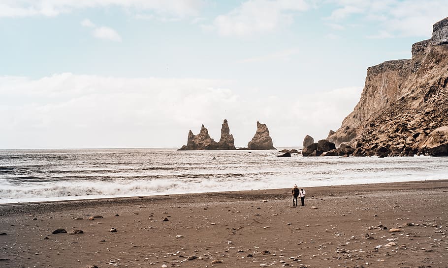 two person walking on seashore under clear blue sky, landscape photography of The Twelve Apostles, Australia HD wallpaper