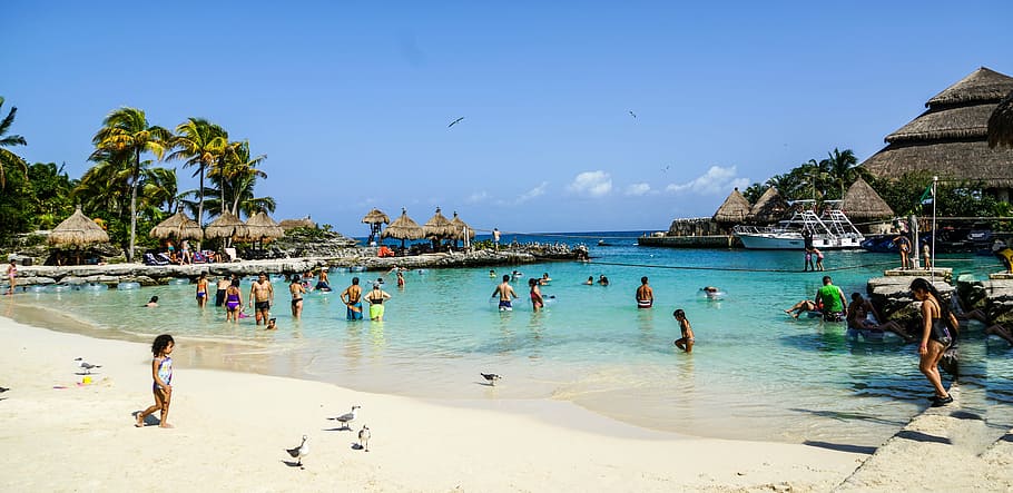 photo of group of people in the beach, xcaret, cancun, mexico