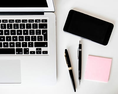 two pens near MacBook Air, MacBook Air near space gray iPhone X HD wallpaper