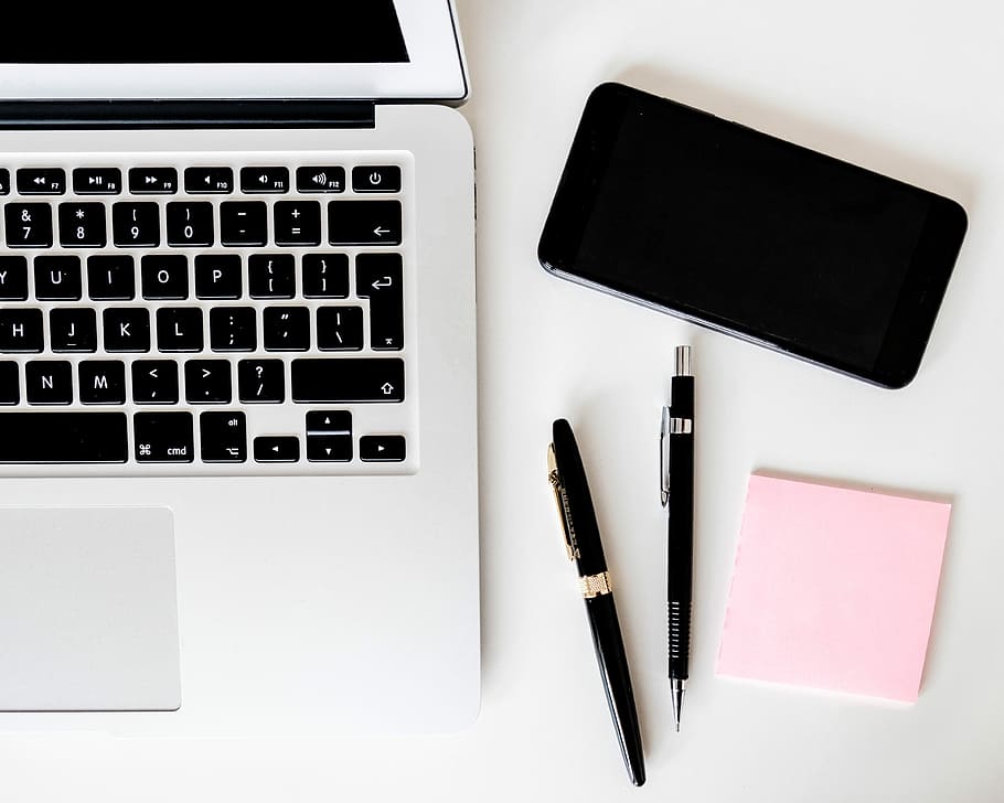 two pens near MacBook Air, MacBook Air near space gray iPhone X HD wallpaper