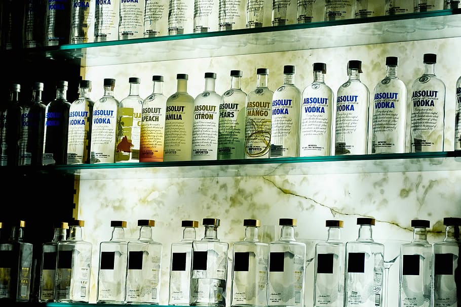Absolute Vodka bottle lot on glass racks, vodka bottle lot on glass-top shelf, HD wallpaper