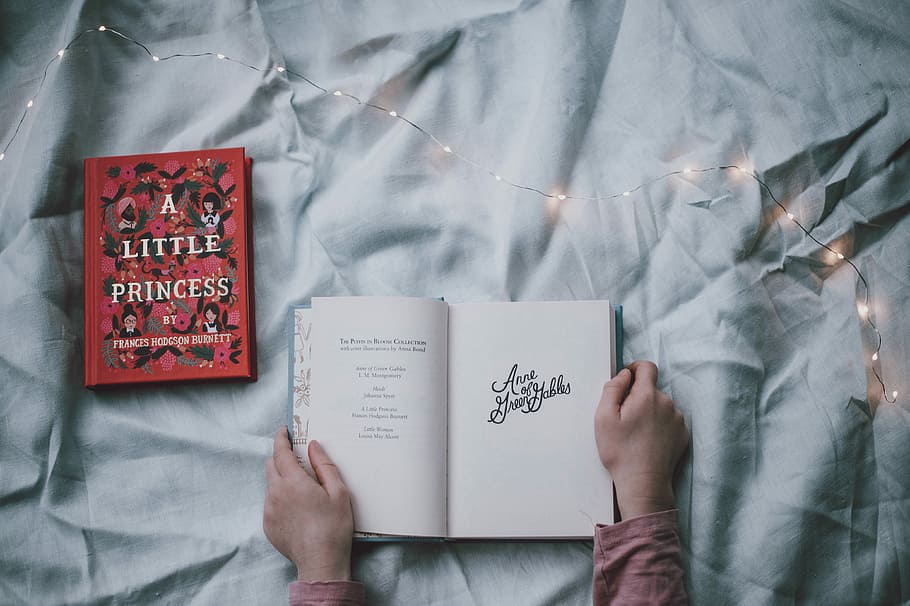 person opened-book, top view photo of person holding open book HD wallpaper