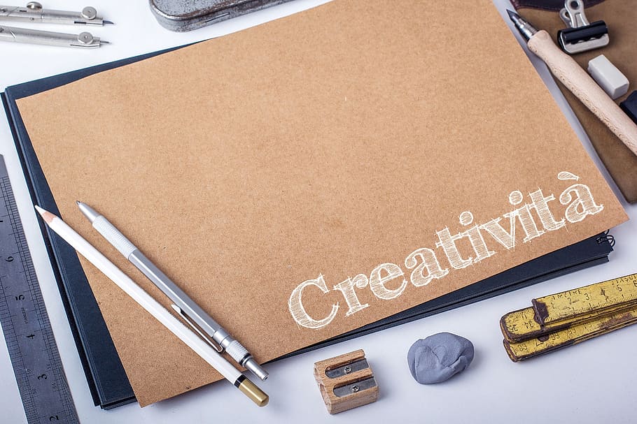 grey click pen beside white pencil on top of brown paper, creativeness HD wallpaper