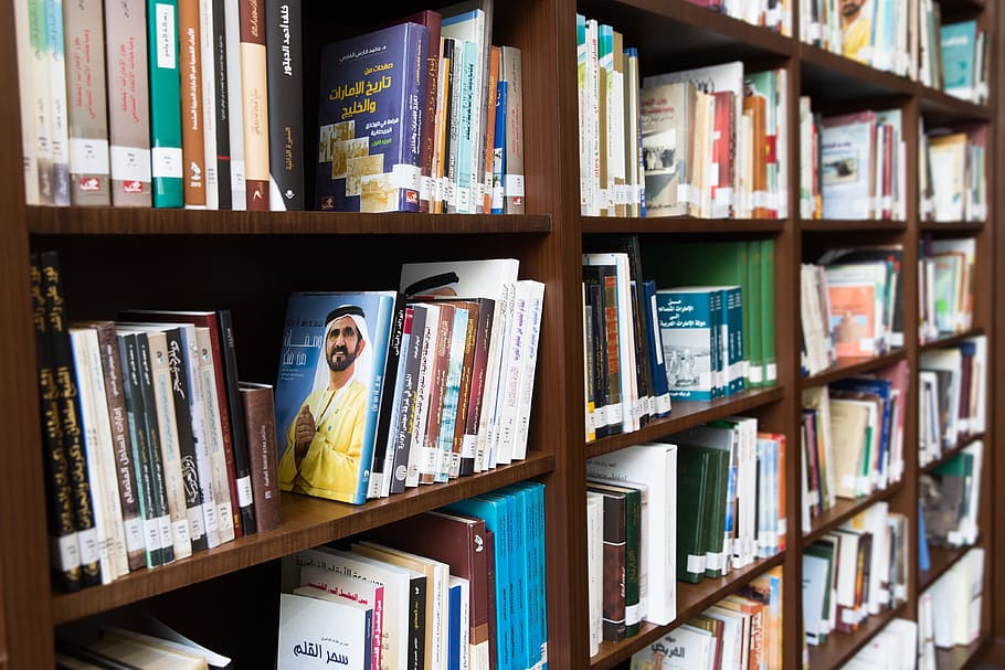 assorted-title book lot on brown wooden bookshelf, Arabic, Library HD wallpaper