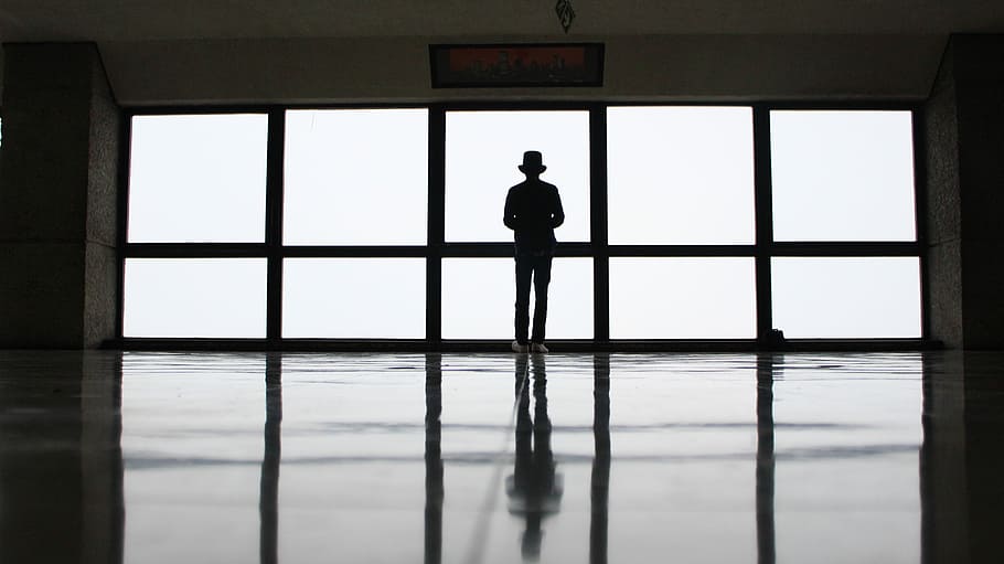 person standing behind glass mirror, window, indoors, people HD wallpaper