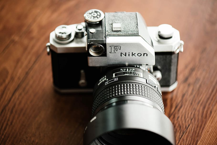 gray and black Nikon DSLR camera on top of brown wooden surface, gray and black F Nikon DSLR camera HD wallpaper