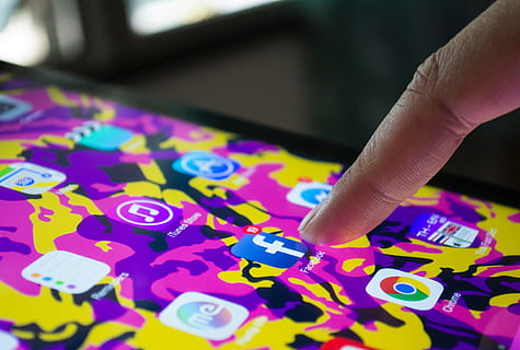 Man checking Facebook app on his iPhone mobile smartphone, technology HD wallpaper