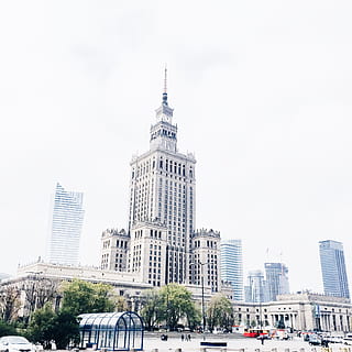 tower clock building, white concrete high-rise building under white sky during daytime HD wallpaper
