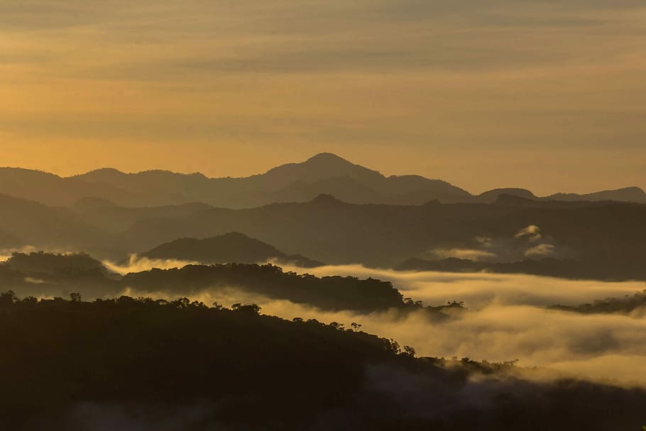 silhouette photo of mountains, fog covered mountain during golden hour HD wallpaper