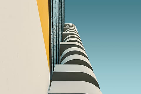 white concrete building at daytime, white and yellow building in low angle photography HD wallpaper