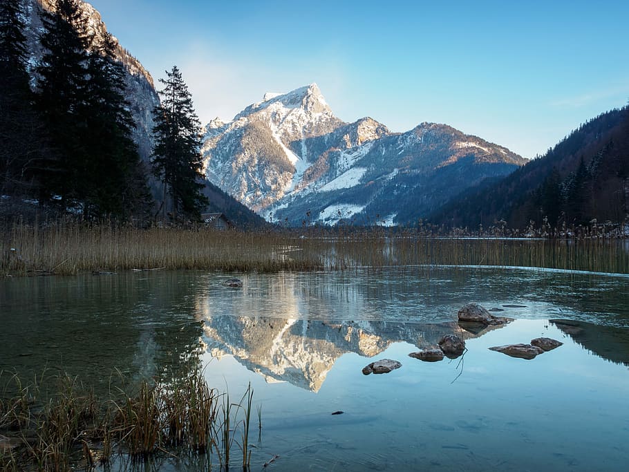 body of water in the middle of mountains during daytime, reflection HD wallpaper