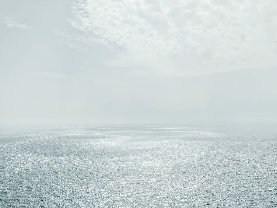 photo of empty ocean during day time, body of water under cloudy sky HD wallpaper