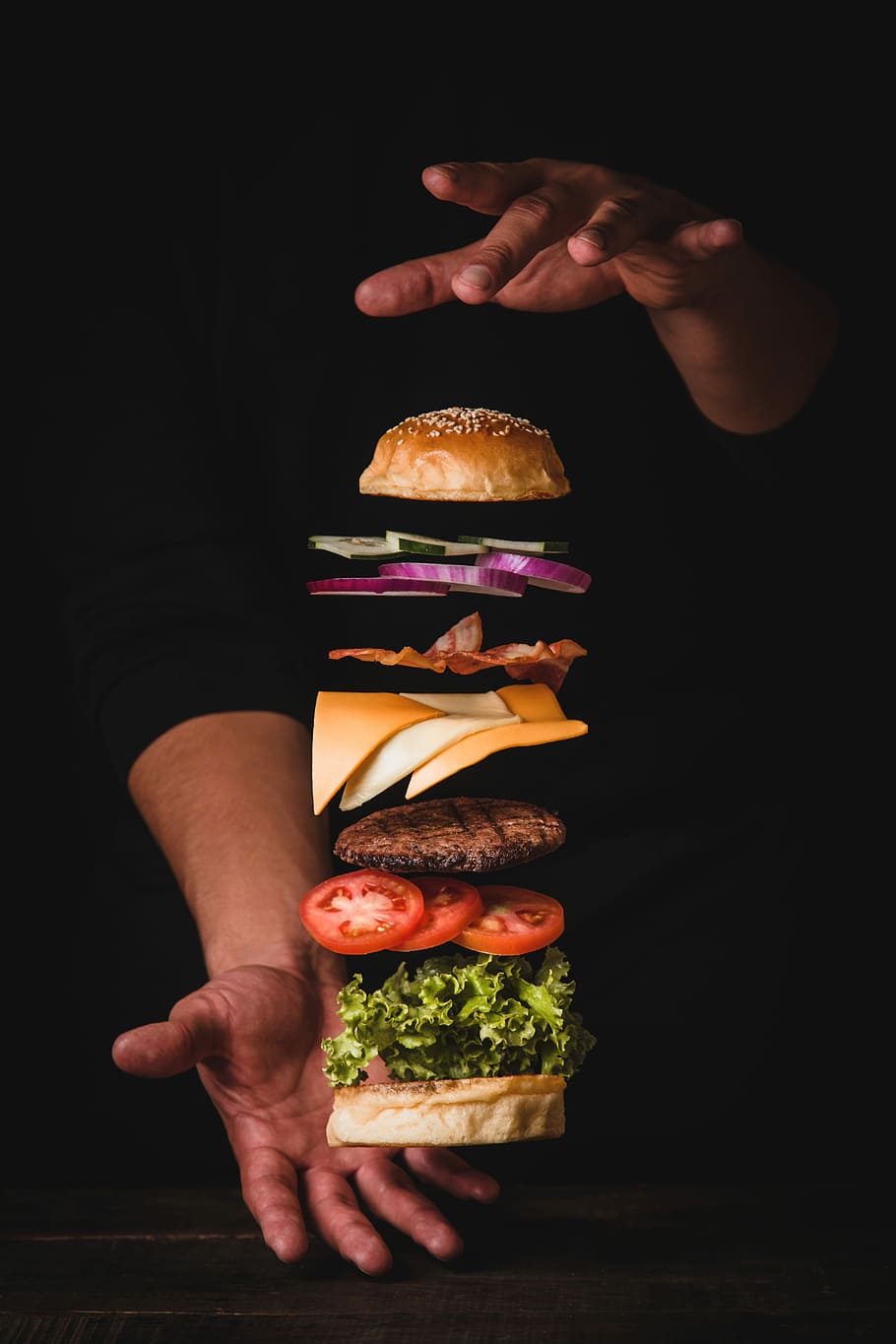 timelapse photo of man holding burger, person stacking meat burger, HD wallpaper