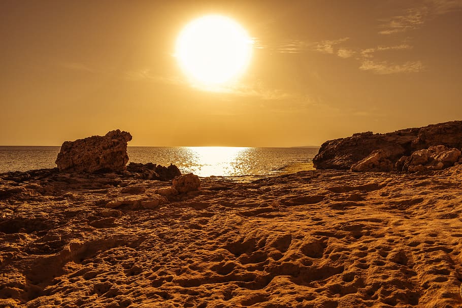 rock formation beside body of water during sunset, afternoon HD wallpaper