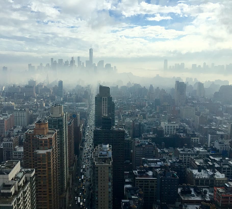 aerial photo of high-rise and low-rise buildings surrounded by fogs, HD wallpaper