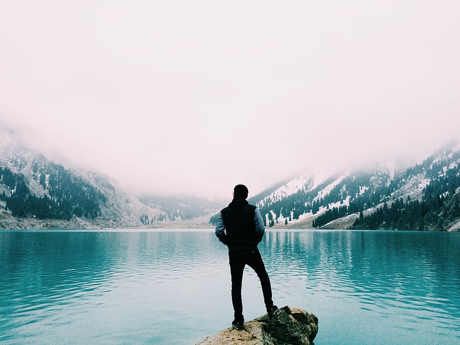 man standing on cliff, mountain lake, person, looking, enjoying