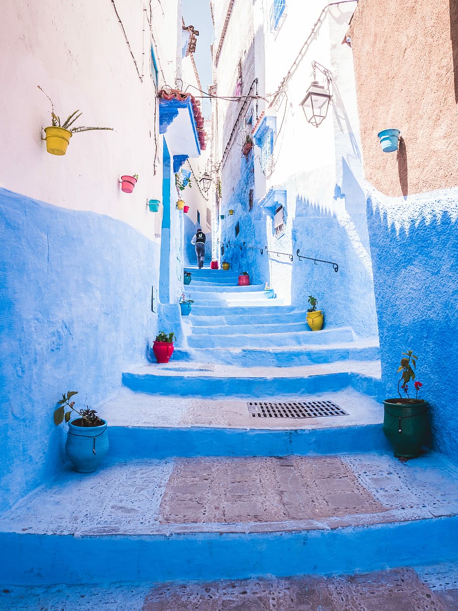 painted street walk during daytime, person walking between concrete wall, HD wallpaper