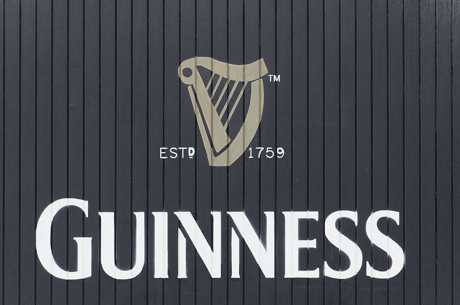Guinness logo, beer, factory, door, text, communication, western script