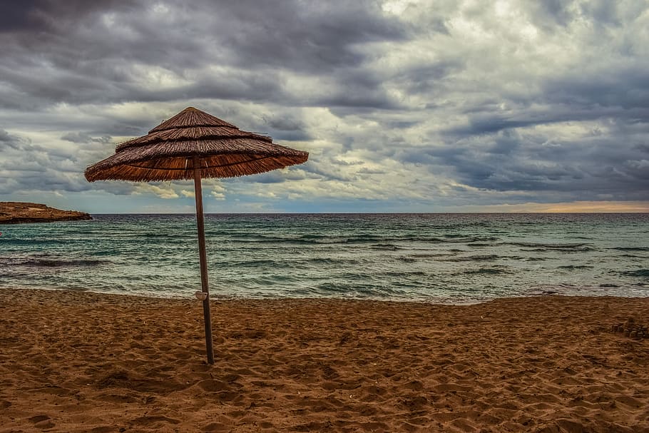 brown cottage on seashore, beach, empty, umbrella, sky, clouds HD wallpaper
