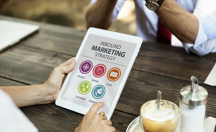person using white tablet computer displaying inbound marketing straterg HD wallpaper