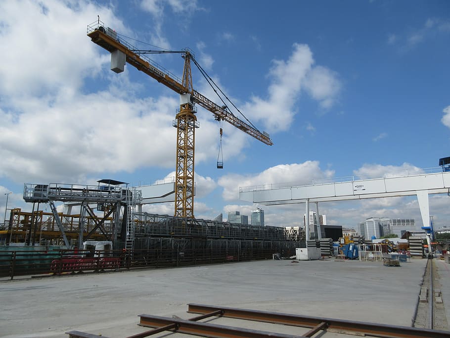 yellow pump jack beside scaffoldings, crane, gantry, construction HD wallpaper