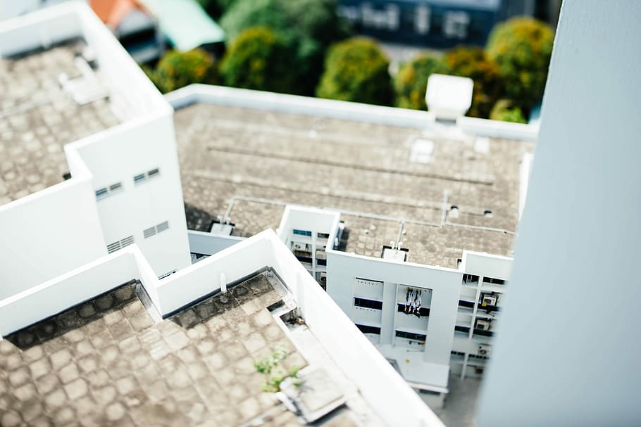 tilt-shift photography of white concrete buildings during daytime, aerial photography of white and brown concrete building HD wallpaper