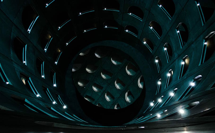 optical illusion photo of tunnel, round black concrete building interior HD wallpaper