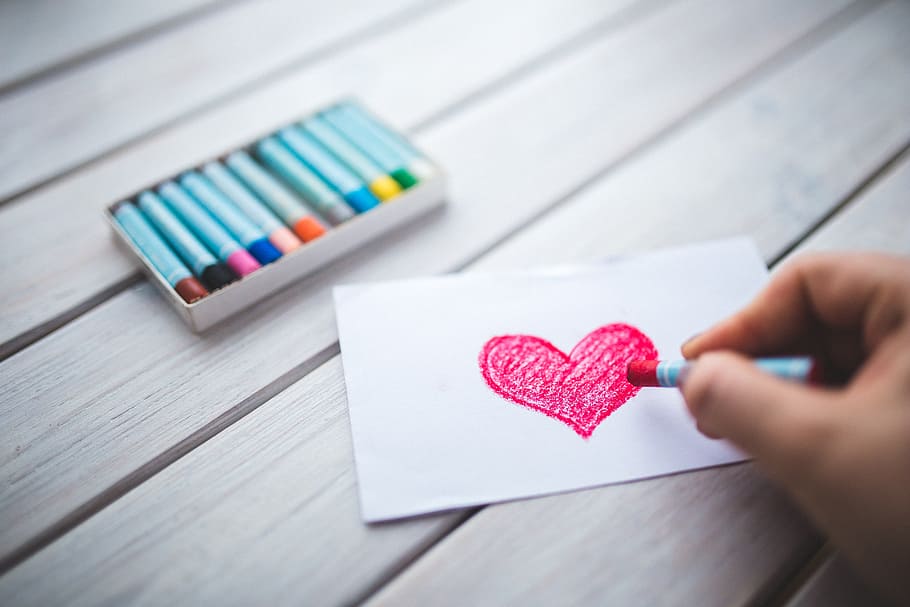focus photography of person's hard coloring red heart, draw HD wallpaper