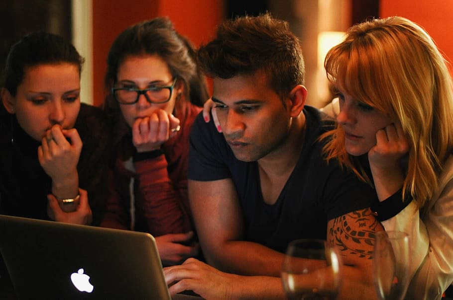 four people looking on turned-on silver MacBook, Curious, Computer HD wallpaper