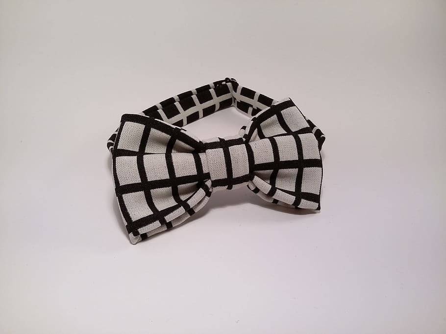 white and black checked bowtie on white surface, bow tie, handmade HD wallpaper