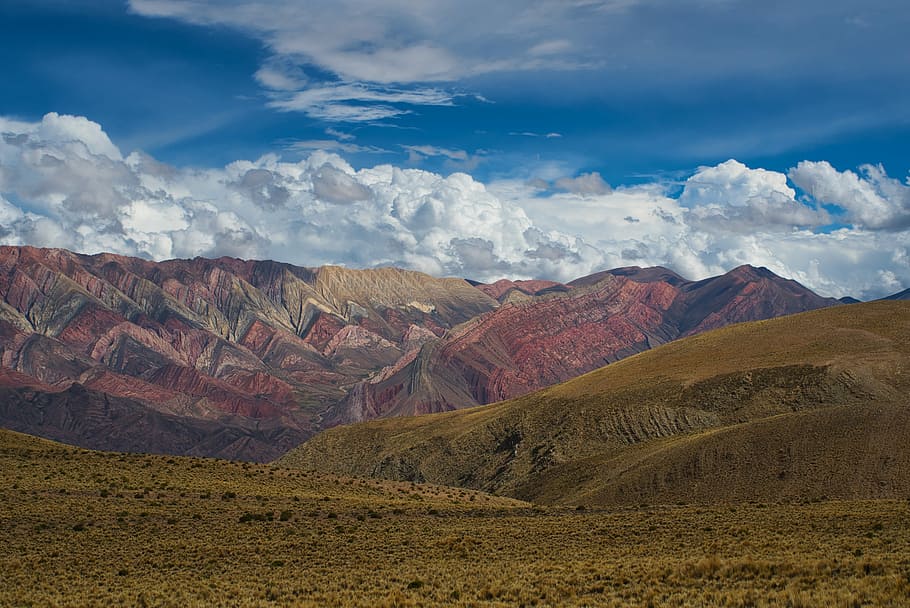 in distant brown mountain, brown and green mountains under cloudy sky HD wallpaper