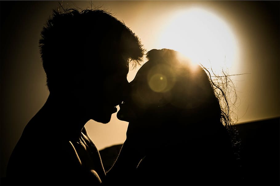 silhouette of man and woman kissing under sun, two, coupe, day