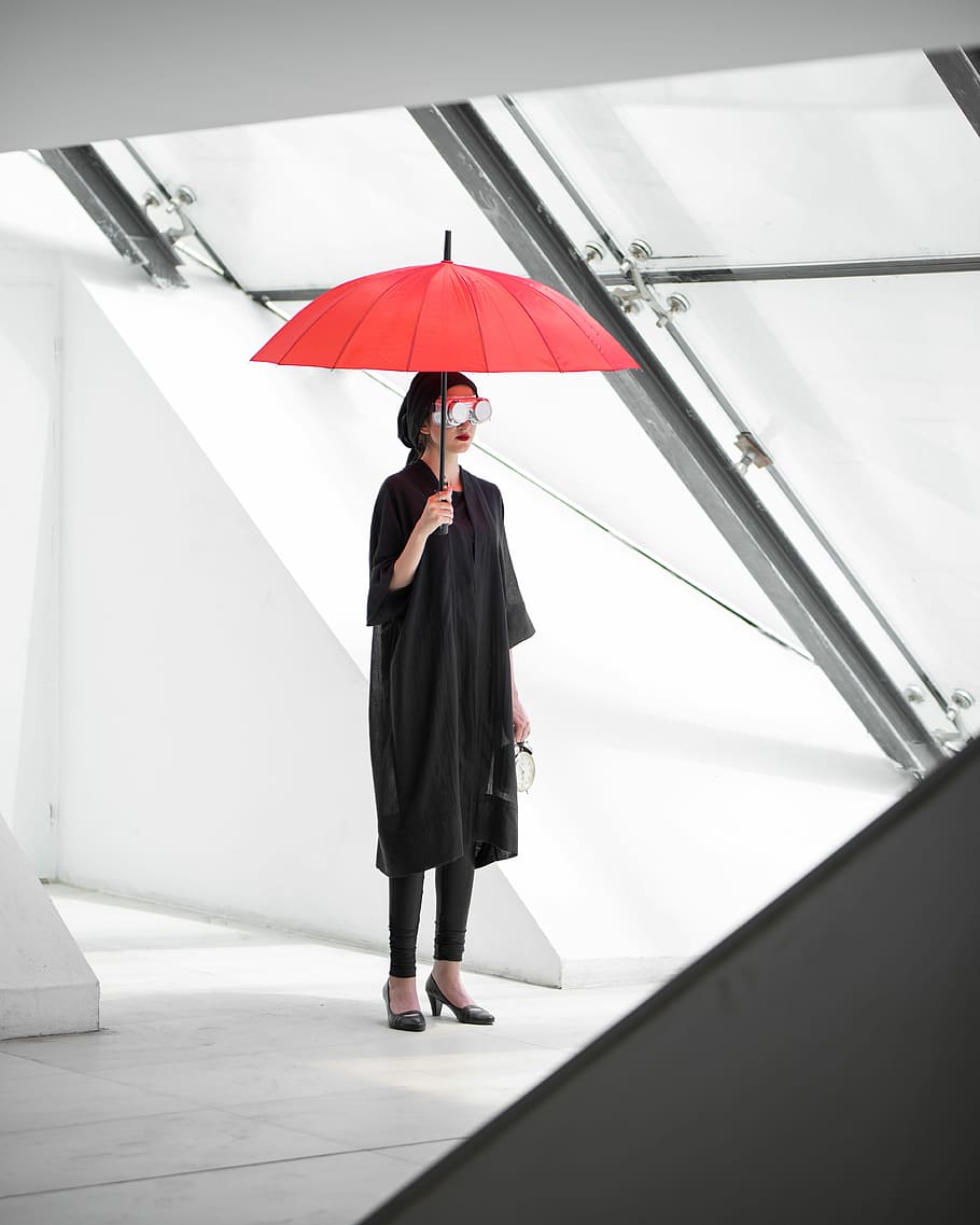 Passing Of Time, woman holding red umbrella, goggle, white, architecture