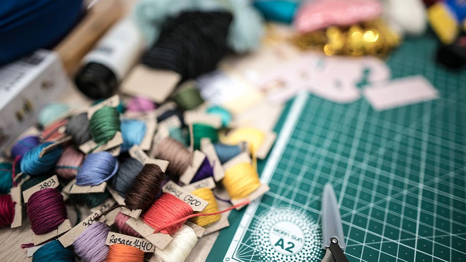 pile of threads, thread rolls on cutting board, cotton, craft HD wallpaper