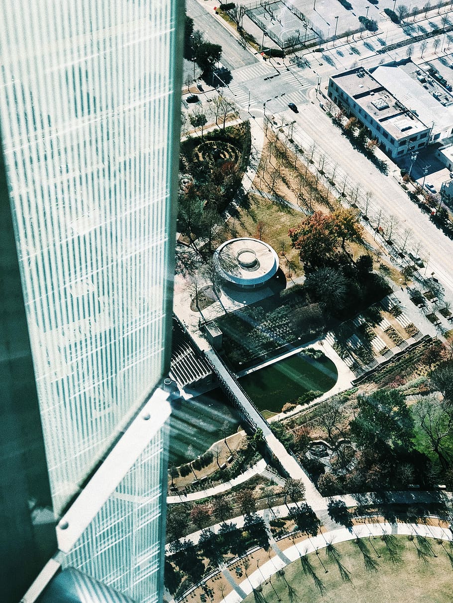 white painted building, aerial view of tall glass building during daytime HD wallpaper